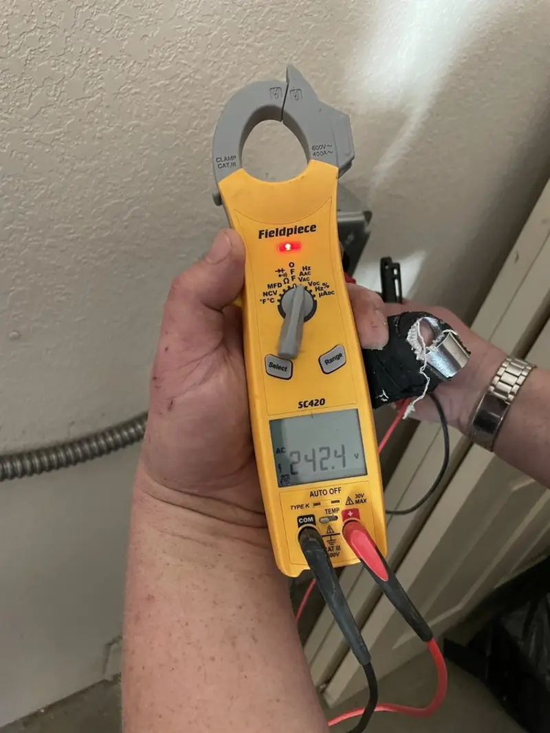 Voltage testing with clamp meter during Electrical Installation Services in Wheelersburg